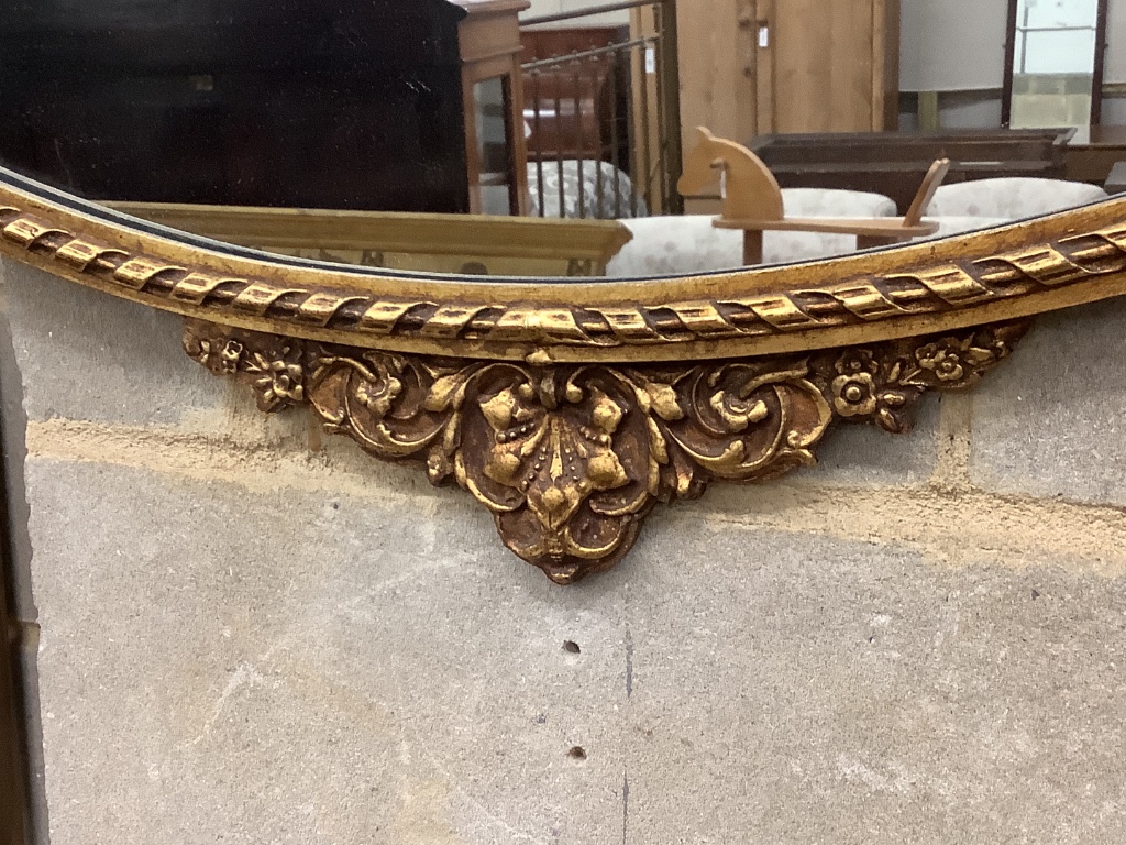 An oval gilt framed Adam design wall mirror, width 80cm height 70cm